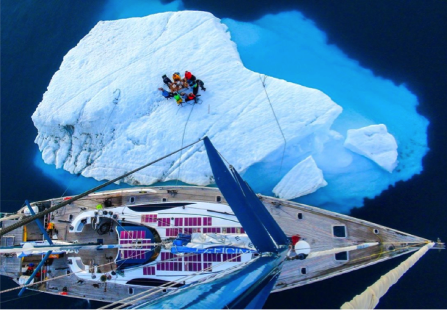 sailboat with iceberg sailboat with iceberg